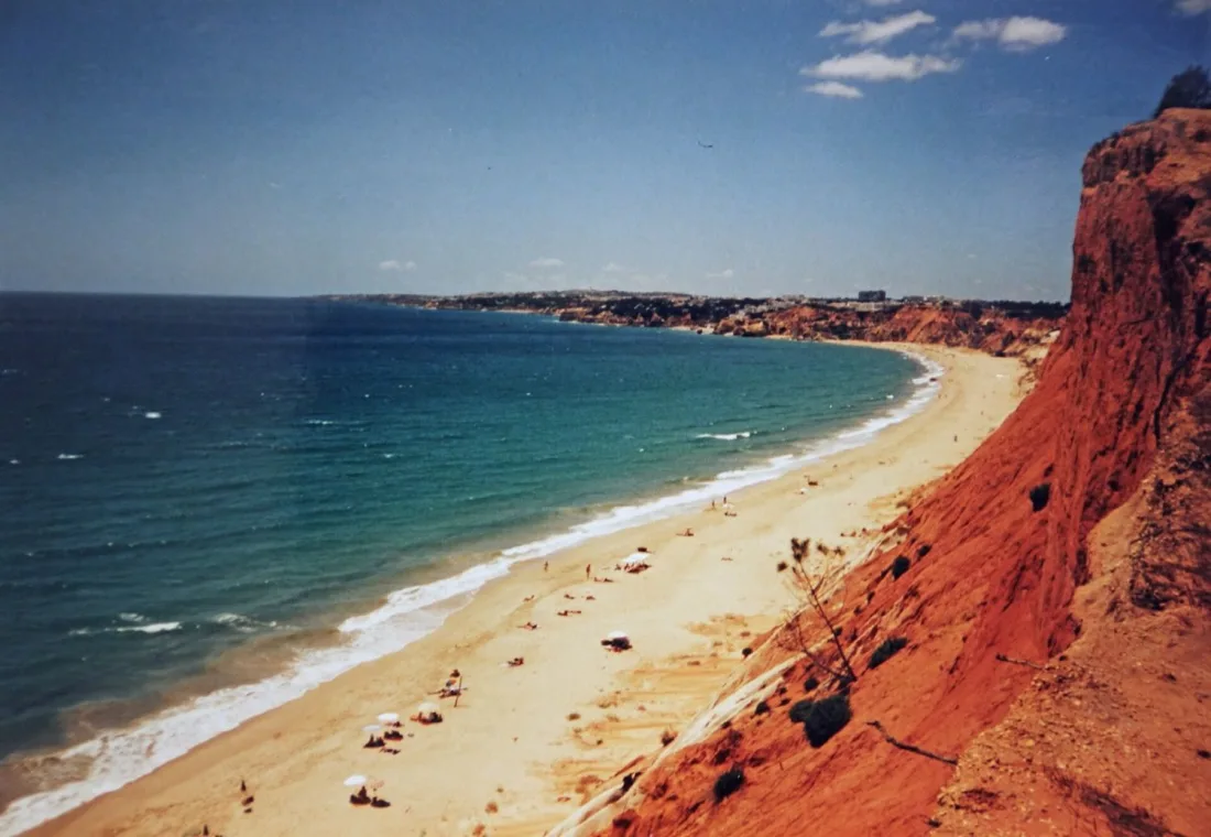 The long red cliffs and golden sand of Praia da Falesia