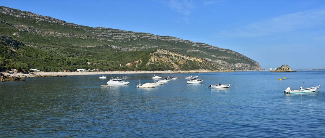 The bay of Portinho da Arrábida under the ridge, with the Anicha islet offshore